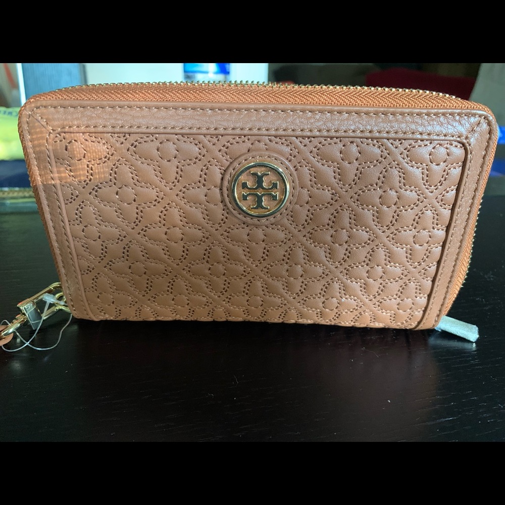 6.5"L x 1"W x 4"H  smartphone wallet wristlet. Zip around closure